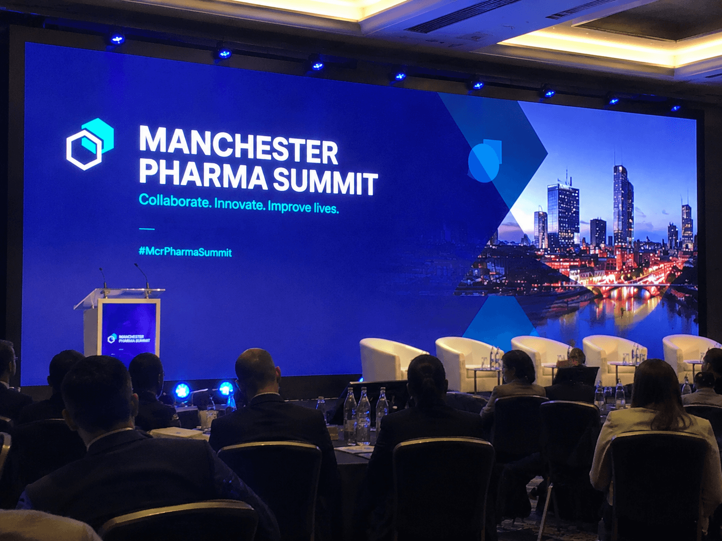 AV production desk facing a pharma congress stage